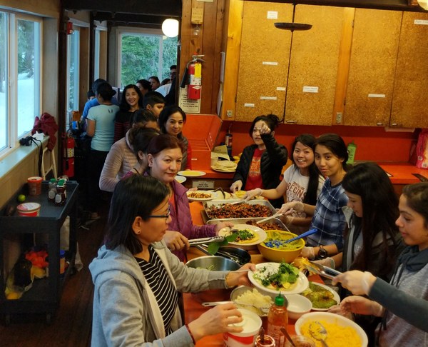 4 - Lodge visitors plating their meal